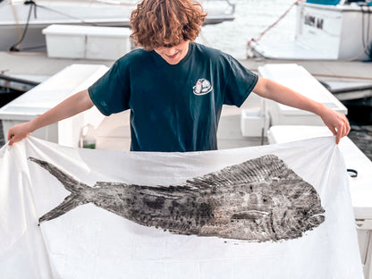 Angler holding large gyotaku fish print made with Fishin Prints Pelagic Pack – offshore fish printing kit