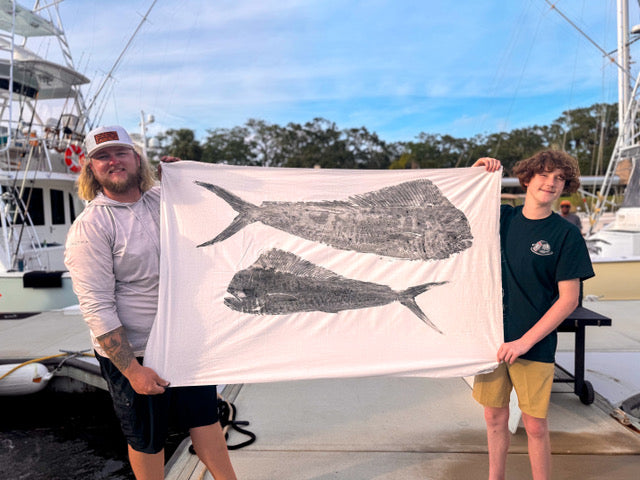 Large Fishing Print of two mahi mahi held by captain eric and a client after fishing offshore.
