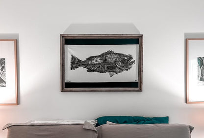 Angler making a gyotaku fish print using Fishin Prints Standard Pack – remember the catch fish printing kit